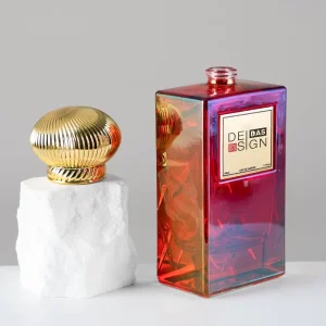 Factory Supply Luxury 50ml Red Iridescent Empty Glass Perfume Bottle with Gold Ribbed Cap for High End Cosmetic Branding