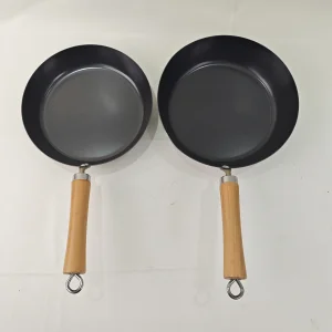 Wholesale Professional Carbon Steel 24cm Non-Stick Frying Pan with Wooden Handle European Design Sustainable Cookware
