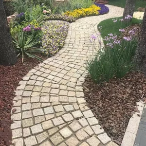 Natural Split and Tumbled China Gold Yellow Granite Cobblestone Paver Curved Walkway