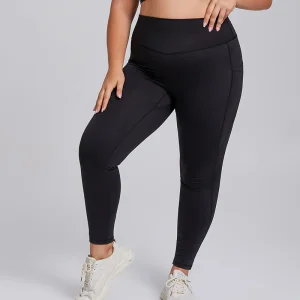 Pantalones de yoga ajustados sin costuras de talla grande con bolsillo para mujeres en el gimnasio