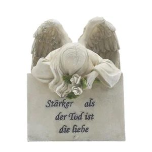 Memorial Angel Lying on Gravestone
