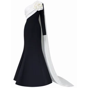 The Monochrome Rose Architectural Gown This striking floor length gown in avant garde tailoring and modern minimalism