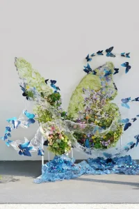 Artificial Greenery Art Installation with Giant Blue Butterflies
