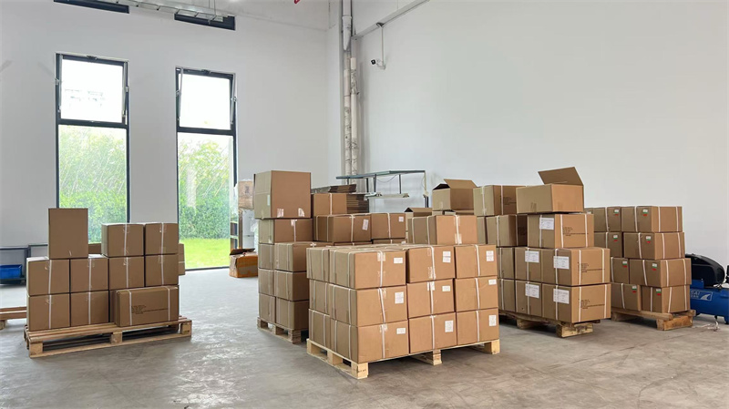 Organized finished goods store with stacked filter press units ready for delivery