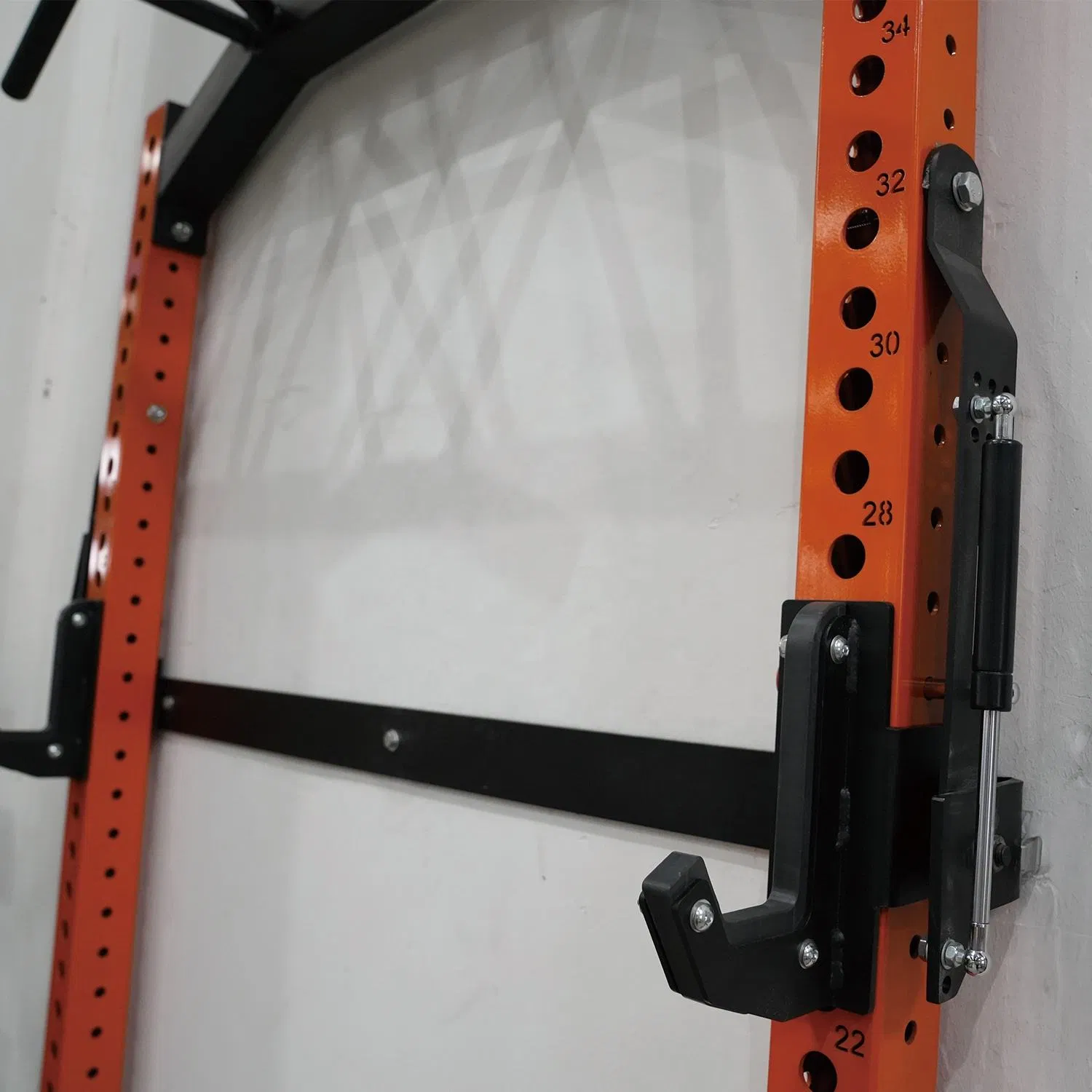 Soporte de sentadillas ajustable y plegable montado en la pared para levantamiento de pesas en casa