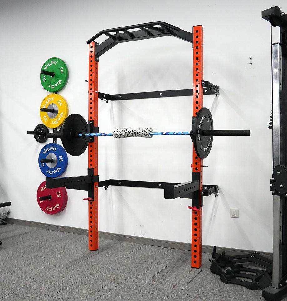 Soporte de sentadillas ajustable y plegable montado en la pared para levantamiento de pesas en casa