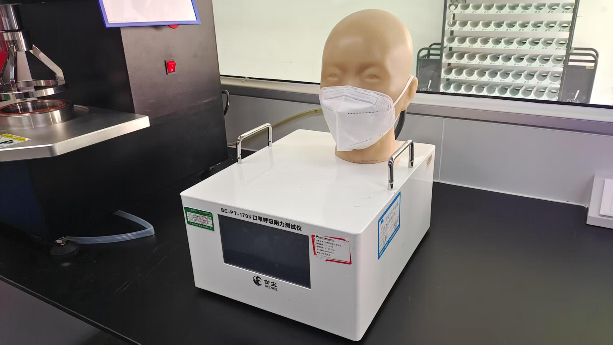 Face mask respiratory resistance tester