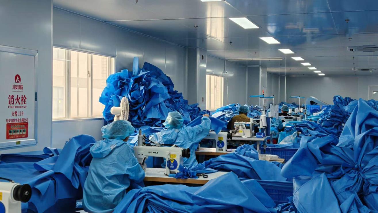 Sewing machines producing disposable protective garments