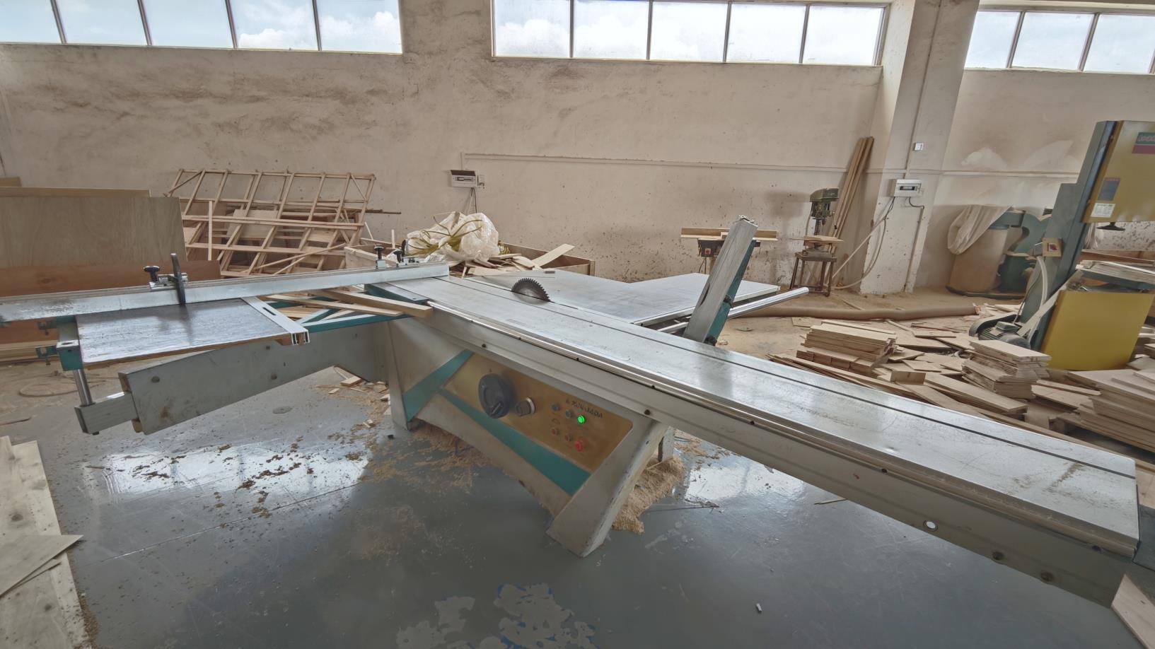 Advanced CNC sliding table saw machine used in Ambrose Home precision wood manufacturing