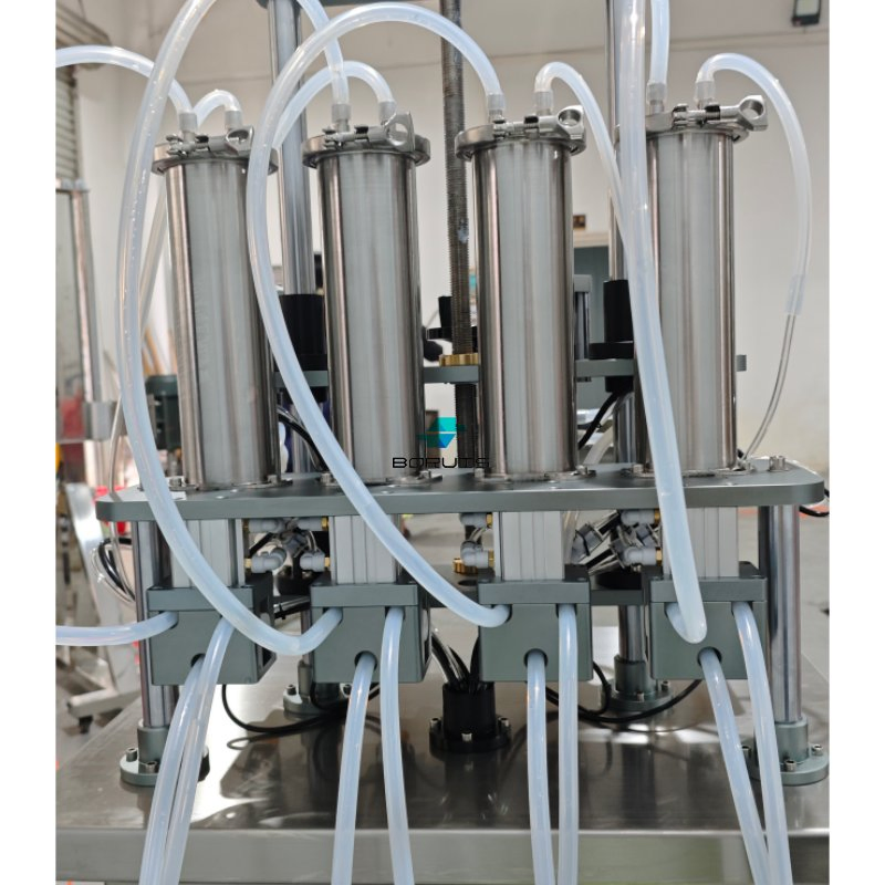 Máquina de llenado de perfume líquido neumática semiautomática para botellas de vidrio de mini tónico y licor