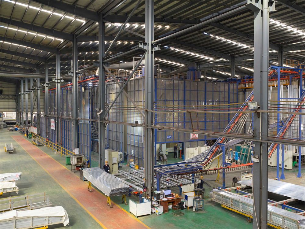 Factory workers assembling aluminum window profiles