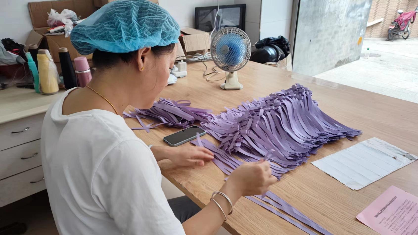 Handmade paper flower assembly — artisan craftsmanship at Shanghai Arden Decor