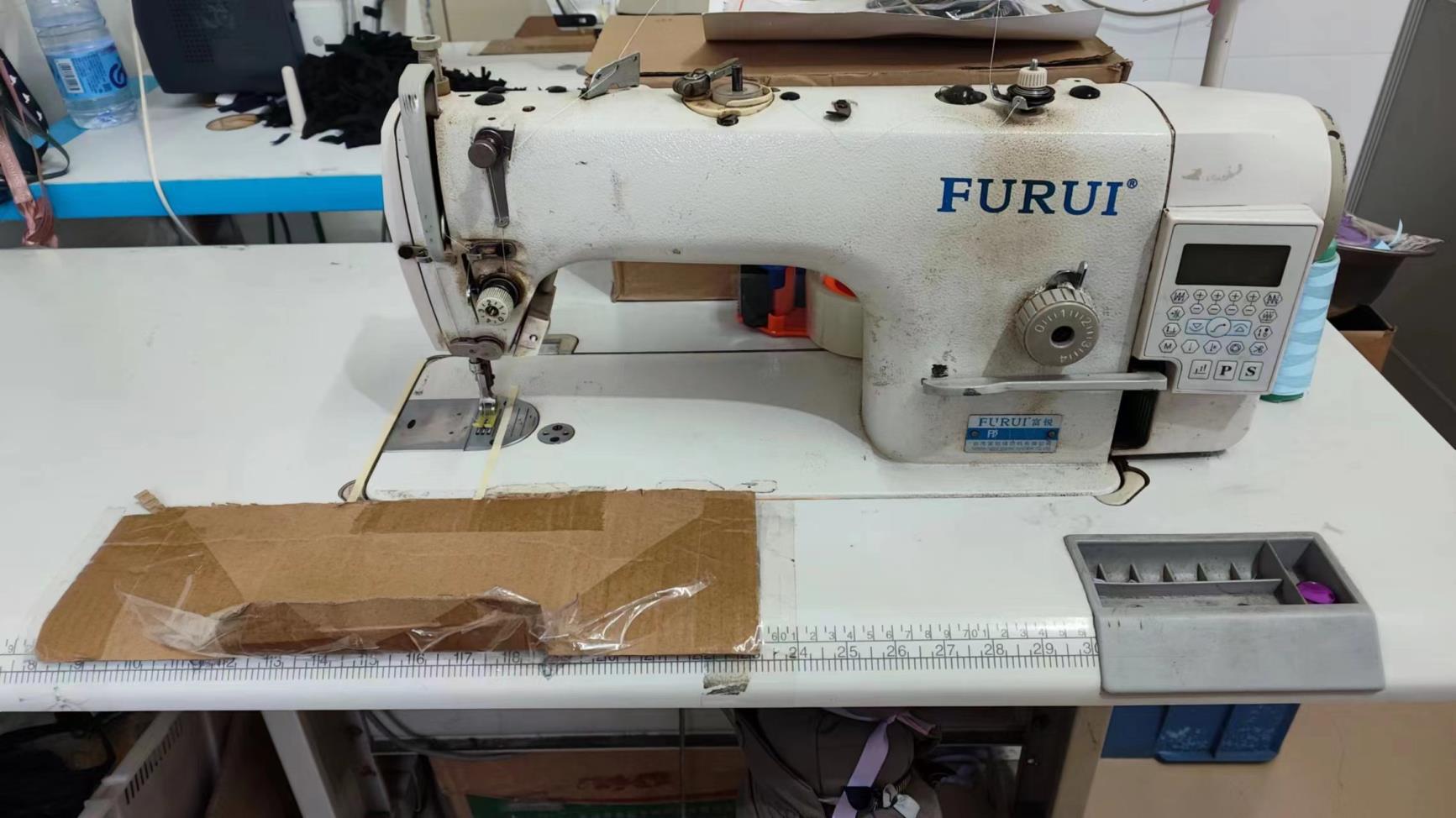 Industrial sewing machine used in paper flower production at Arden Decor factory