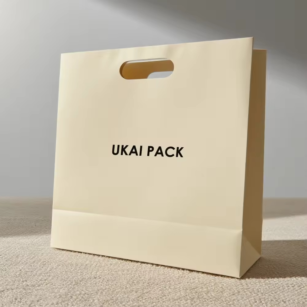 Custom Logo Printed Biodegradable Brown Kraft Paper Bag Luxury Gift Shopping Paper Bag Packaging With Die Cut Handle