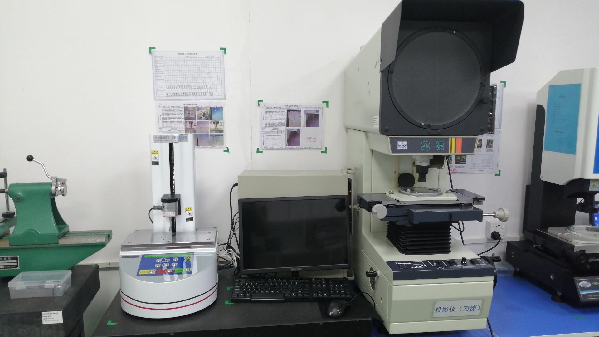 Optical projector for dimensional inspection of micro motor components