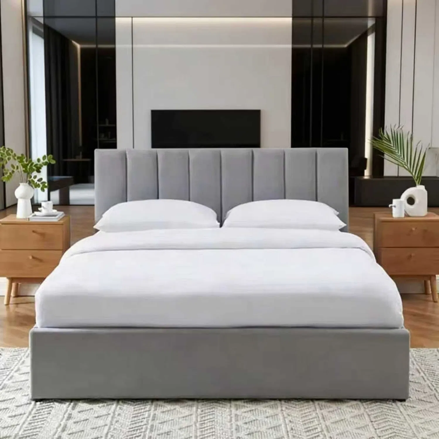 Estructura de cama tipo trineo tapizada con cabecera y pie de cama acolchados curvados, incluyendo base de listones de madera para soporte