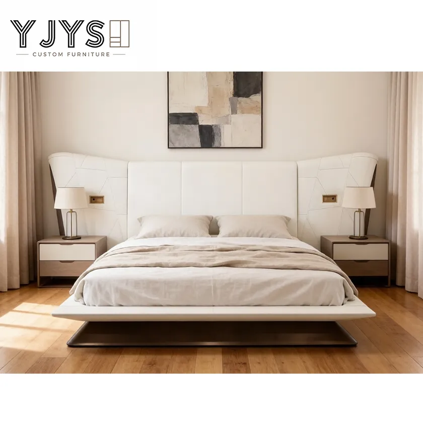 Cama de plataforma de cuero acolchado en forma de ala con mesitas de noche integradas, muebles de lujo para interiores