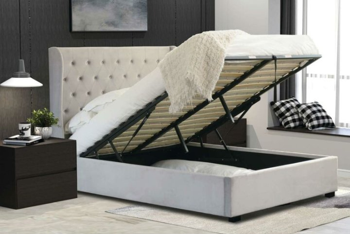 Estructura de cama plataforma tapizada con elevación de gas y cabecera con botones y almacenamiento