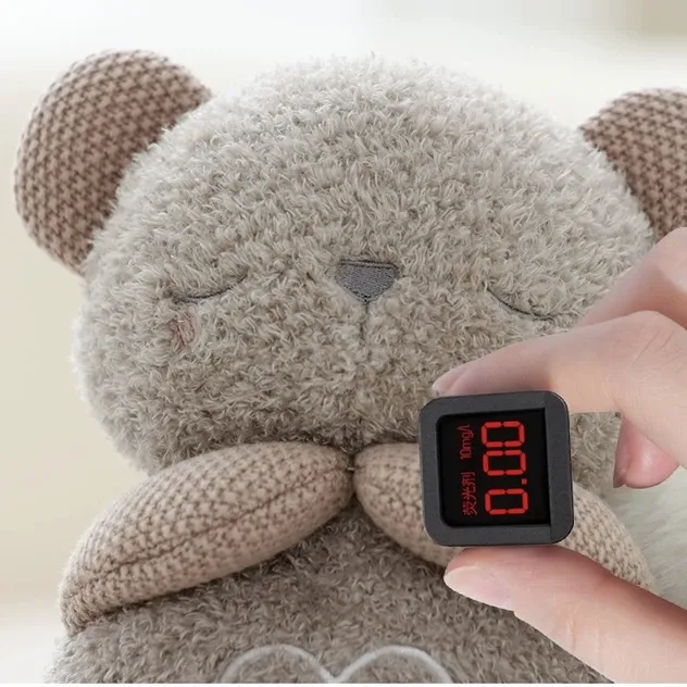 Juguete de oso de peluche que respira para calmar y arrullar a los recién nacidos