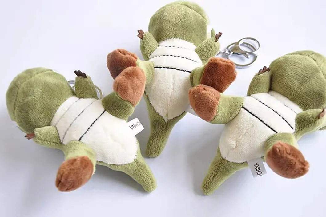 Detalle Llavero Peluche Dinosaurio