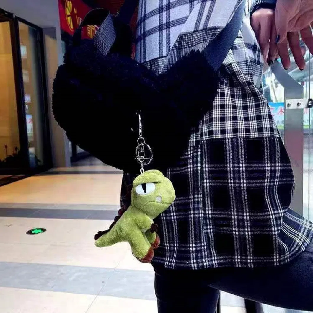 Detalle Llavero Peluche Dinosaurio