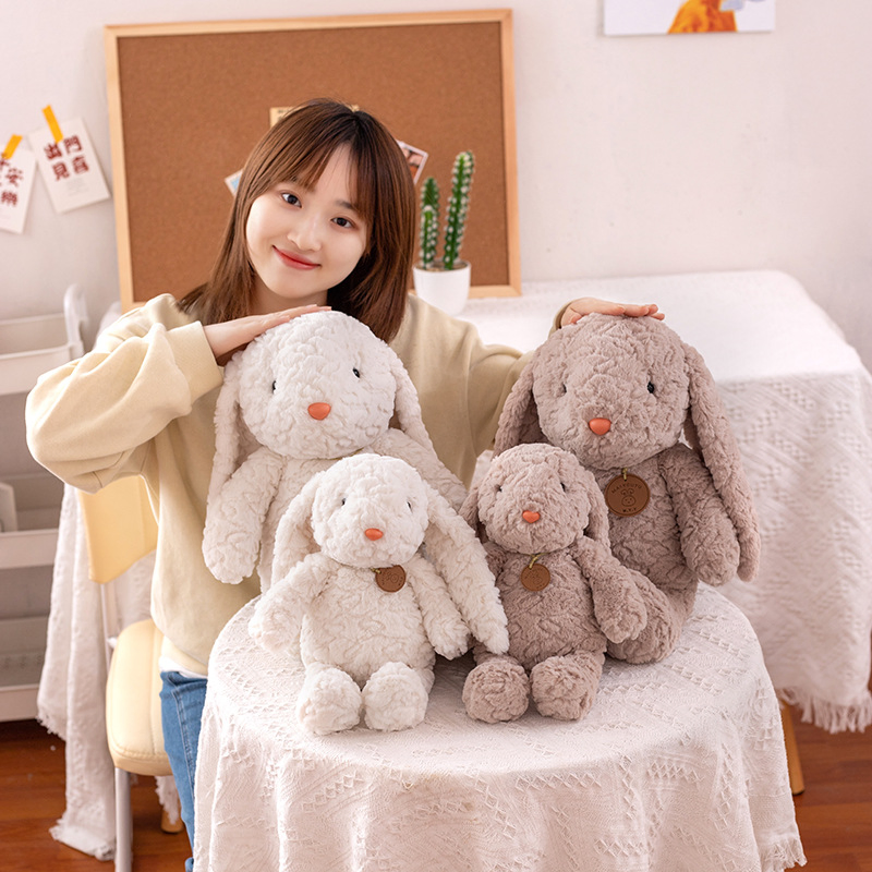 Precio mayorista de peluches personalizados diseño a medida animales súper suaves muñeca abrazable y acogedora conejito oso perro oveja juguetes para niños fábrica