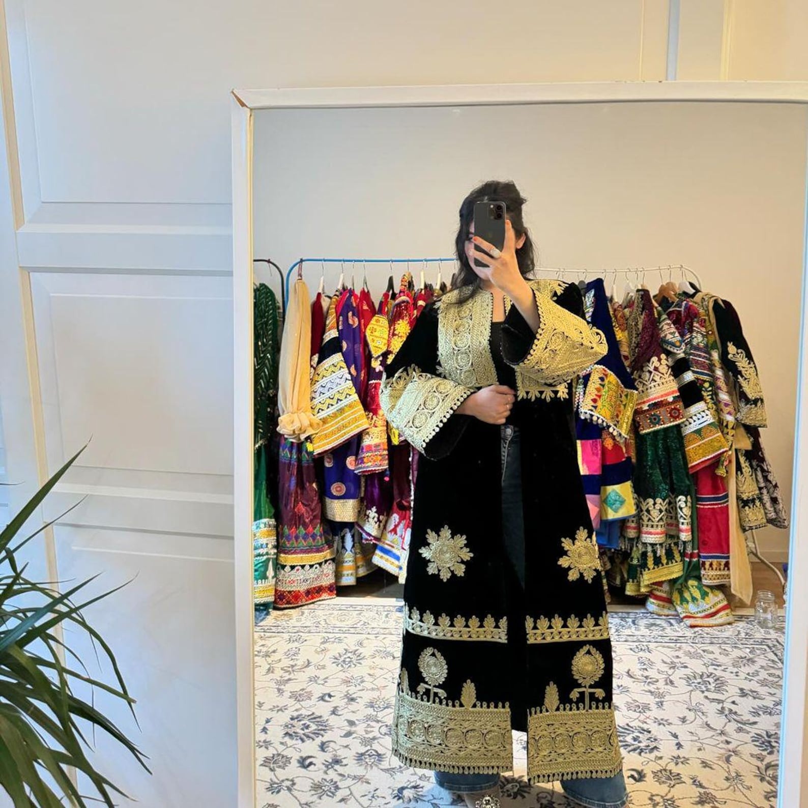 Short Black Velvet Afghan Style Coat With Gold And Silver Mirror Embroidery Detail Wide Sleeves Paired With Black Jumpsuit