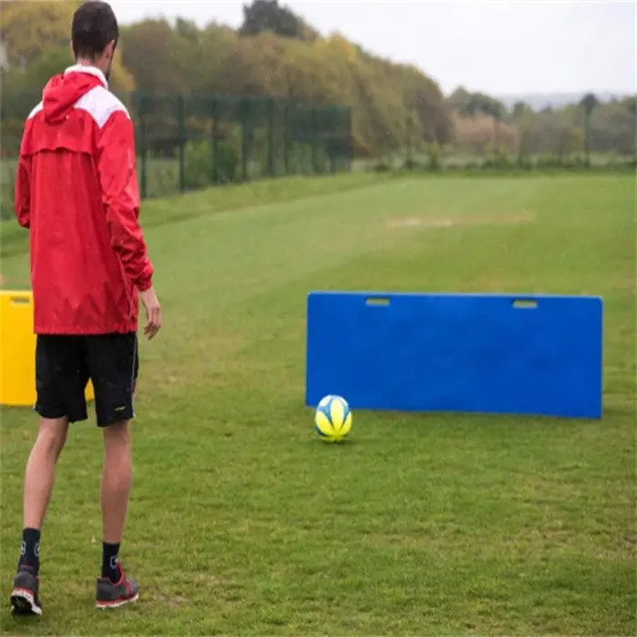 Professional football team training with rebounders