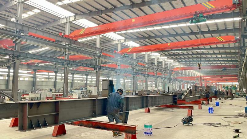 Professional welding operations on steel structure components