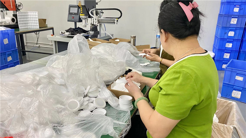 Powder cosmetics packing and quality inspection at Jenae Beauty production line