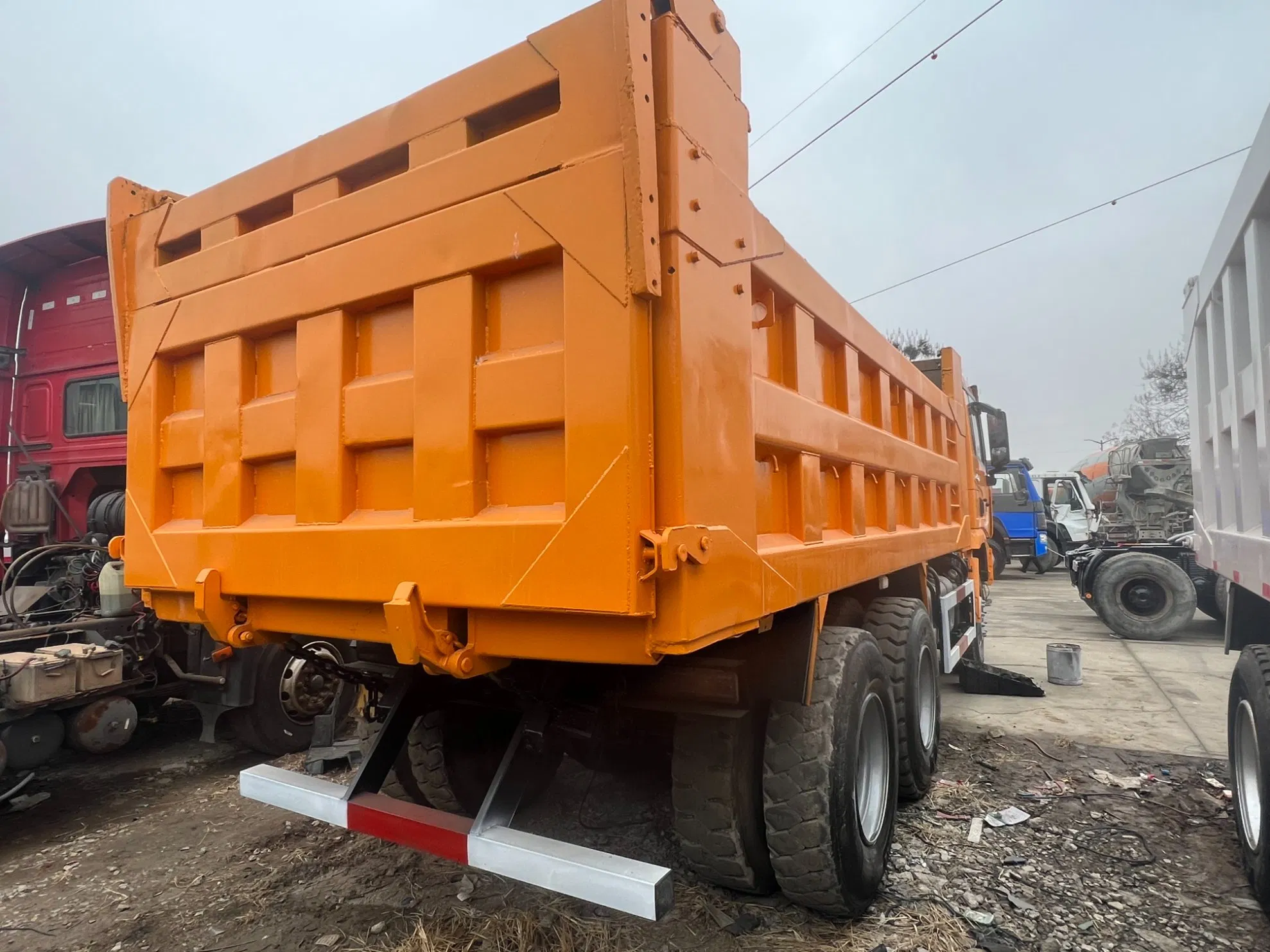 Heavy Construction Transport Vehicles. Chinese Shakman Dump Trucks with 10 Wheels and 12 Wheels, Box-Type Dump Trucks, Freight Vehicles
