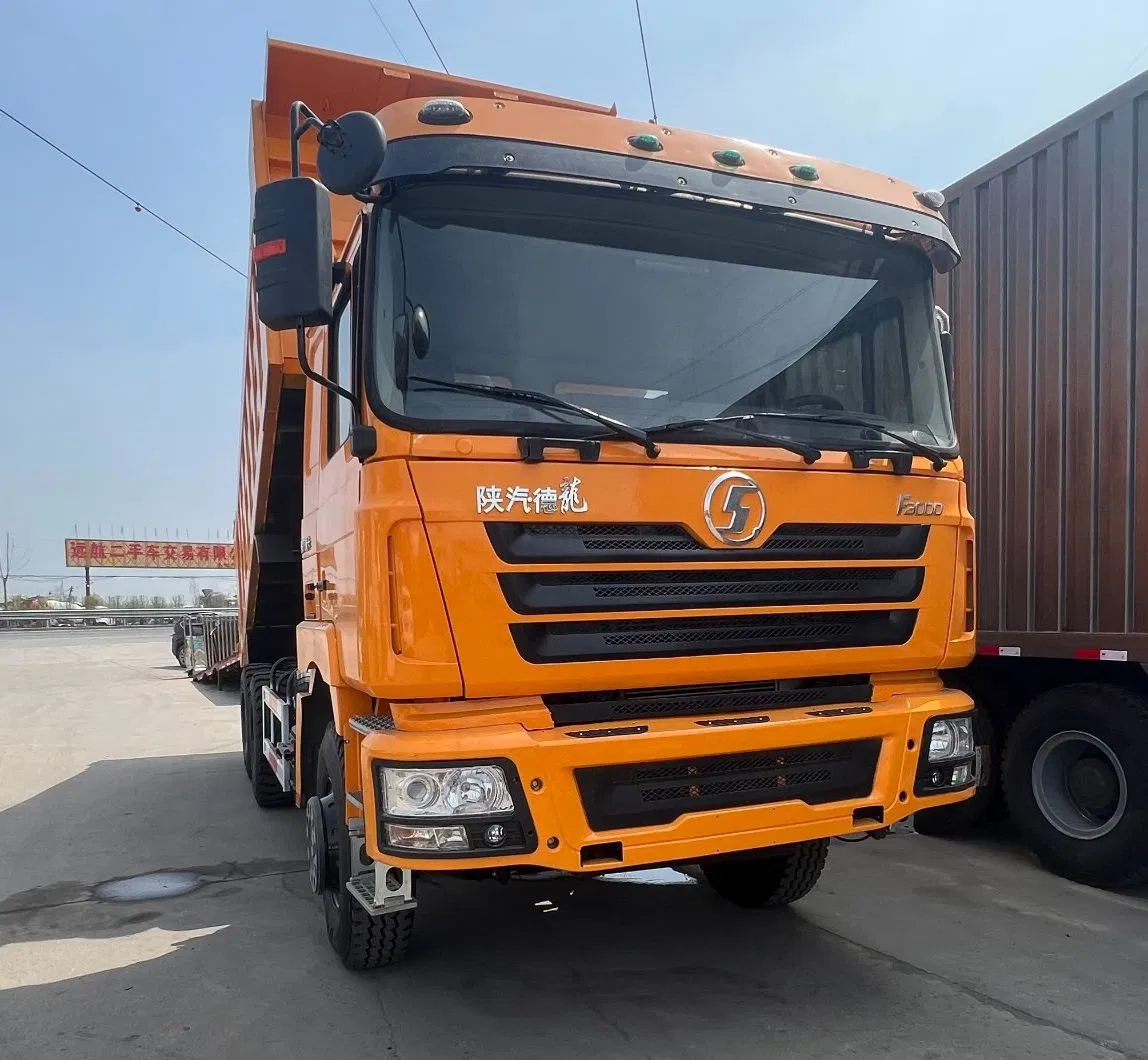 Heavy Construction Transport Vehicles. Chinese Shakman Dump Trucks with 10 Wheels and 12 Wheels, Box-Type Dump Trucks, Freight Vehicles