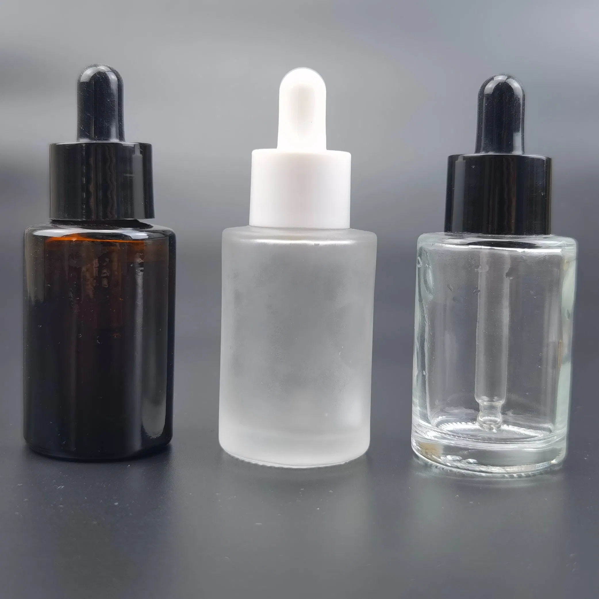 Wholesale Flat Shoulder 30ml 50ml 60ml 100ml Amber Frosted Transparent Black Essential Oil Glass Dropper Bottle