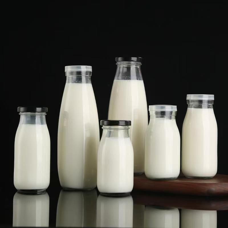 Wholesale High Quality Empty 100ml 250ml 500ml 1 Liter Beverage Milk Juice Glass Bottles with Lid
