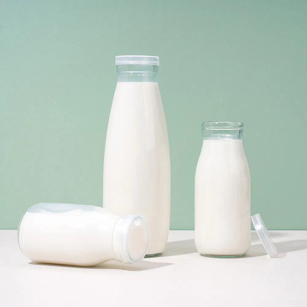 Factory Direct OEM Custom Logo Drinking Bottle Empty Transparent Glass Beverage Milk Bottles with Plastic Lids