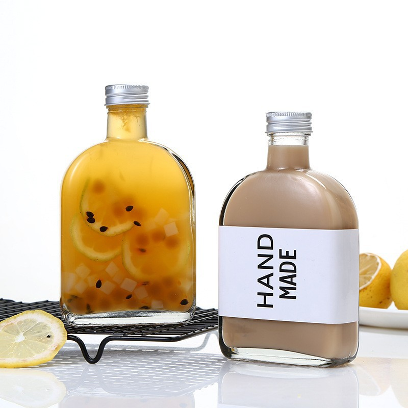 Hot Sale Reusable Glass Water Bottles with Stainless Steel Lids to Store Home Brews, Oils, Vinaigrettes, Wines, Beer, Teas