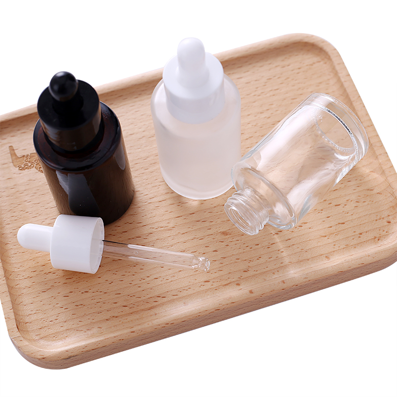 Wholesale Flat Shoulder 30ml 50ml 60ml 100ml Amber Frosted Transparent Black Essential Oil Glass Dropper Bottle