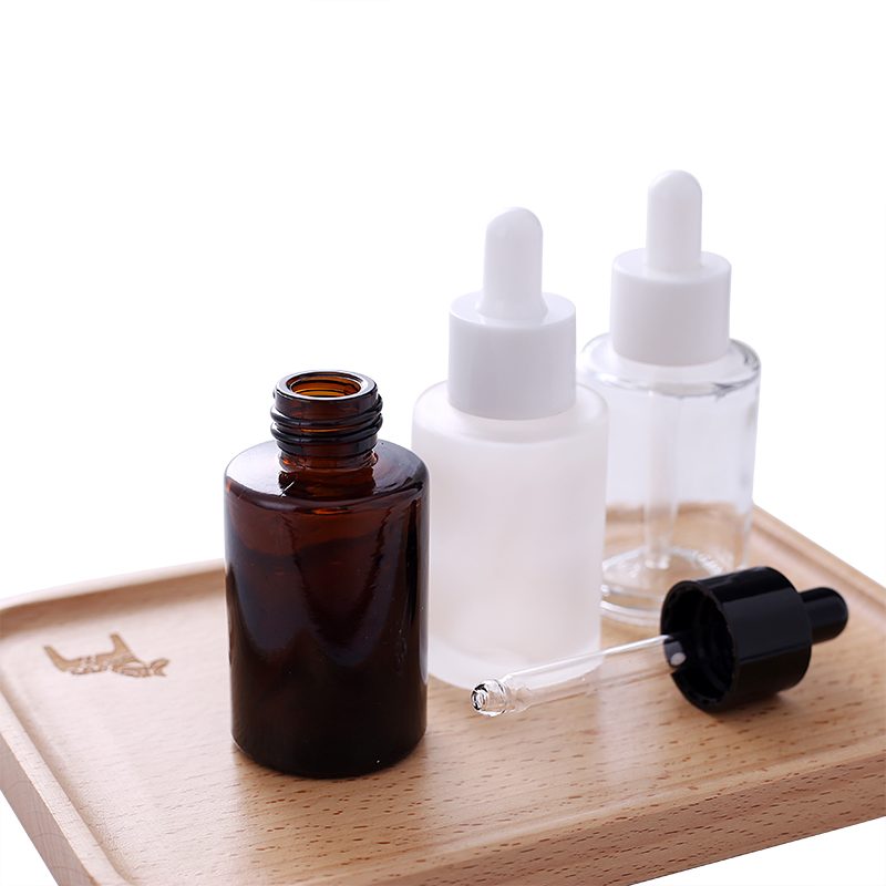 Wholesale Flat Shoulder 30ml 50ml 60ml 100ml Amber Frosted Transparent Black Essential Oil Glass Dropper Bottle
