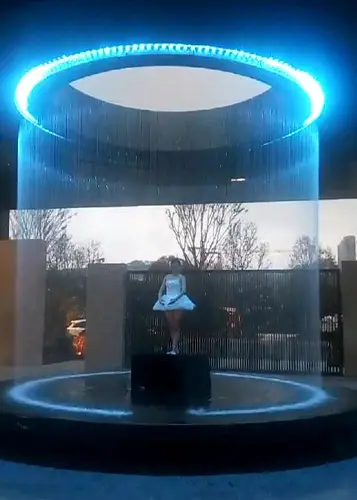 Digital water curtain displaying patterns in falling water