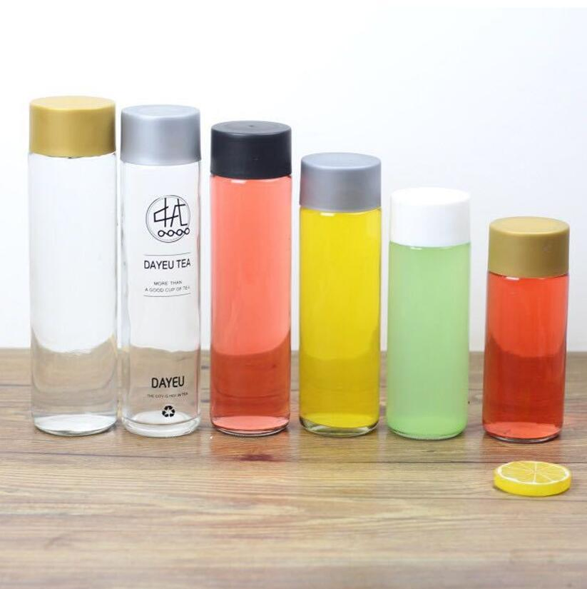Wholesale Disposable Pet Juice Beverage Bottle Empty Transparent Glass Water Bottle Slender with Lid Beverage Bottle