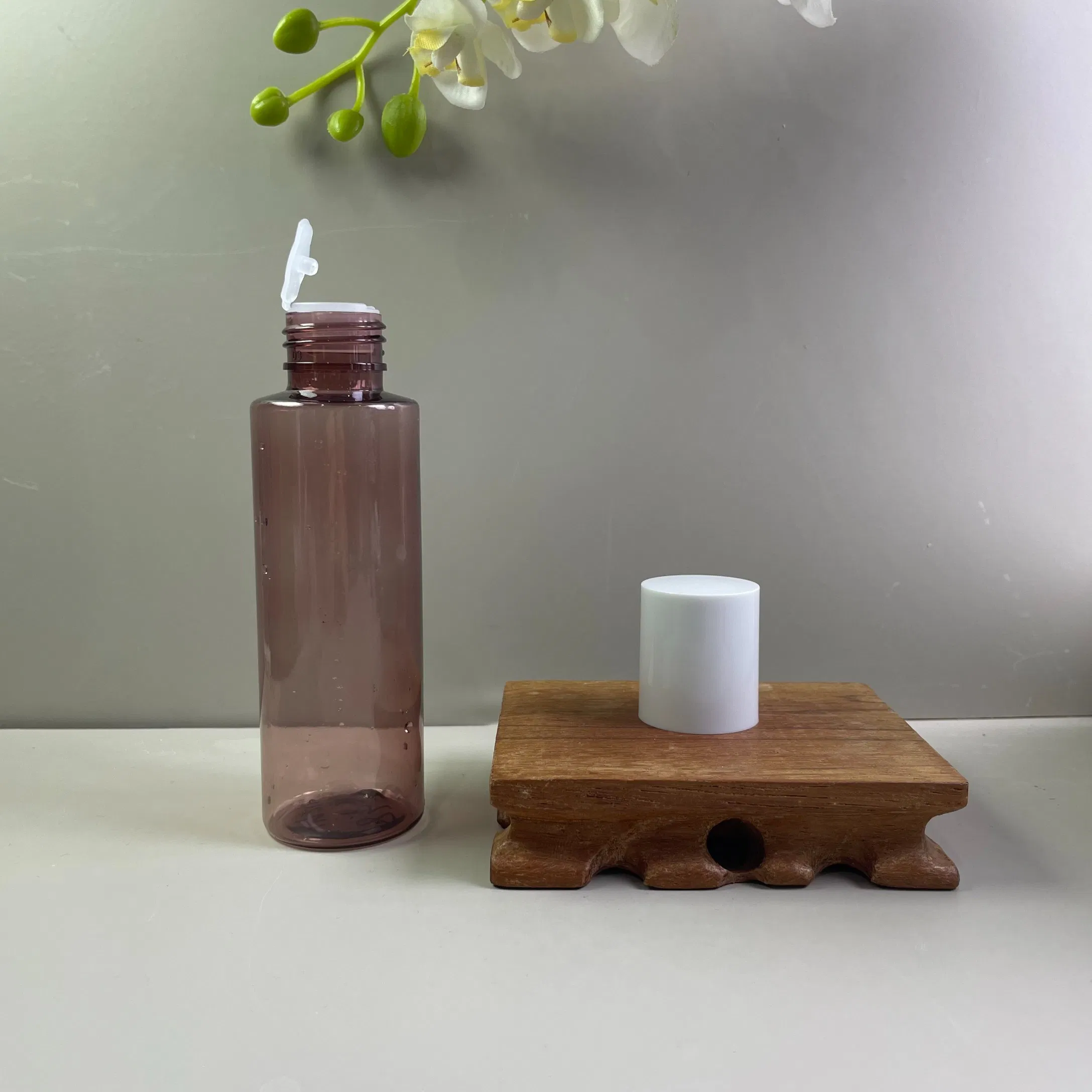 100ml Pet Plastic Bottle with Inner Stopper Caps, Flat-Shoulder Flip-Top Empty Bottles for Toner, Lotion, Shampoo, and Shower Gel.