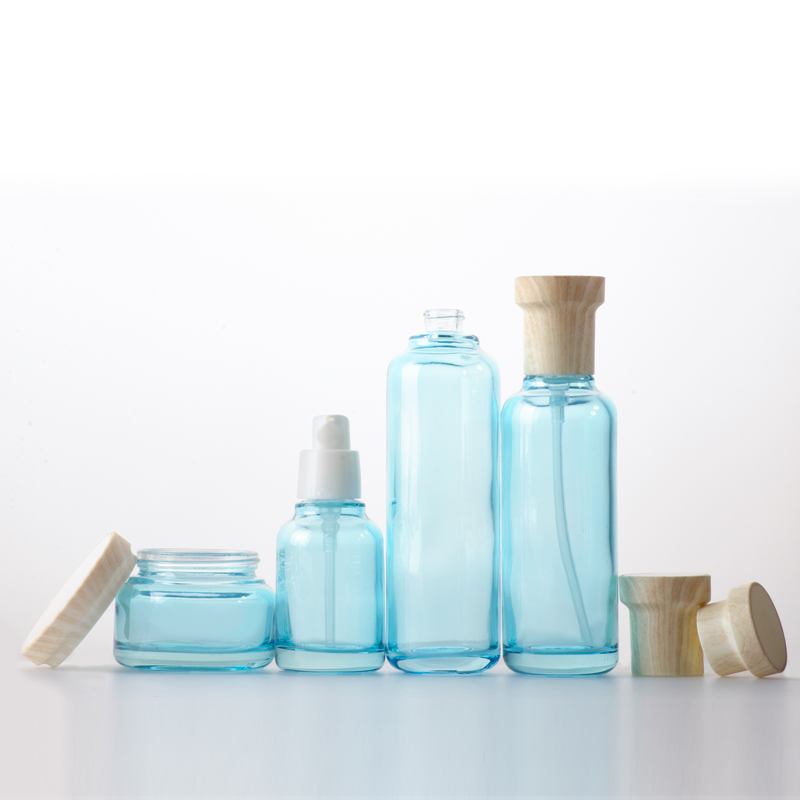 Hot Sale Blue Pink Clear Cosmetic Glass Bottle with Cap and Jar Set for Cosmetics Containers and Packaging