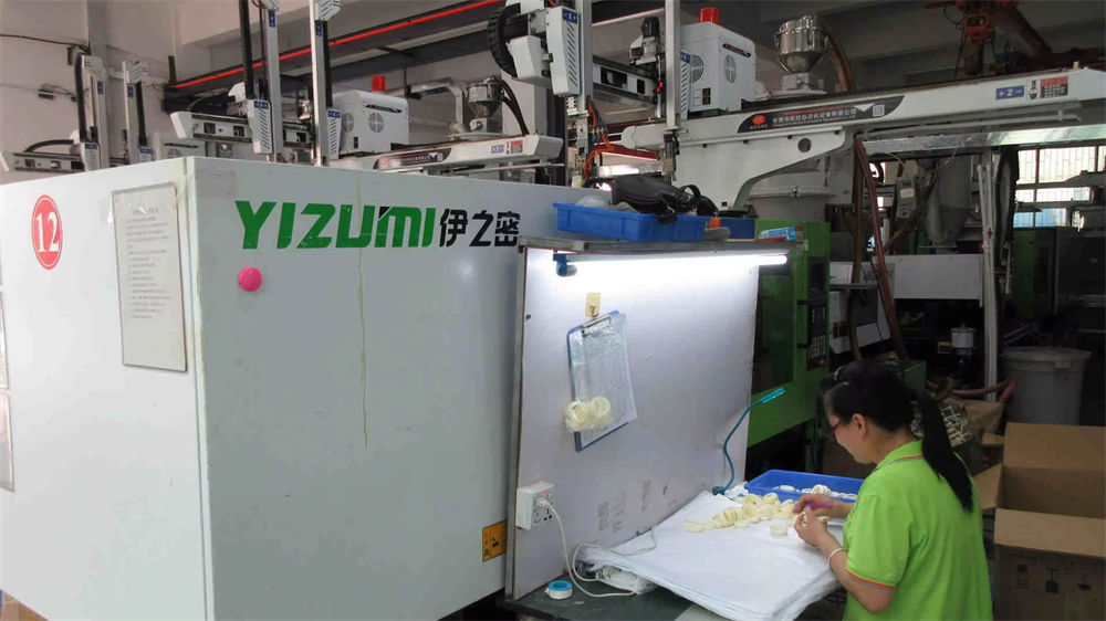 Plastic injection molding process at BryMax Beauty factory