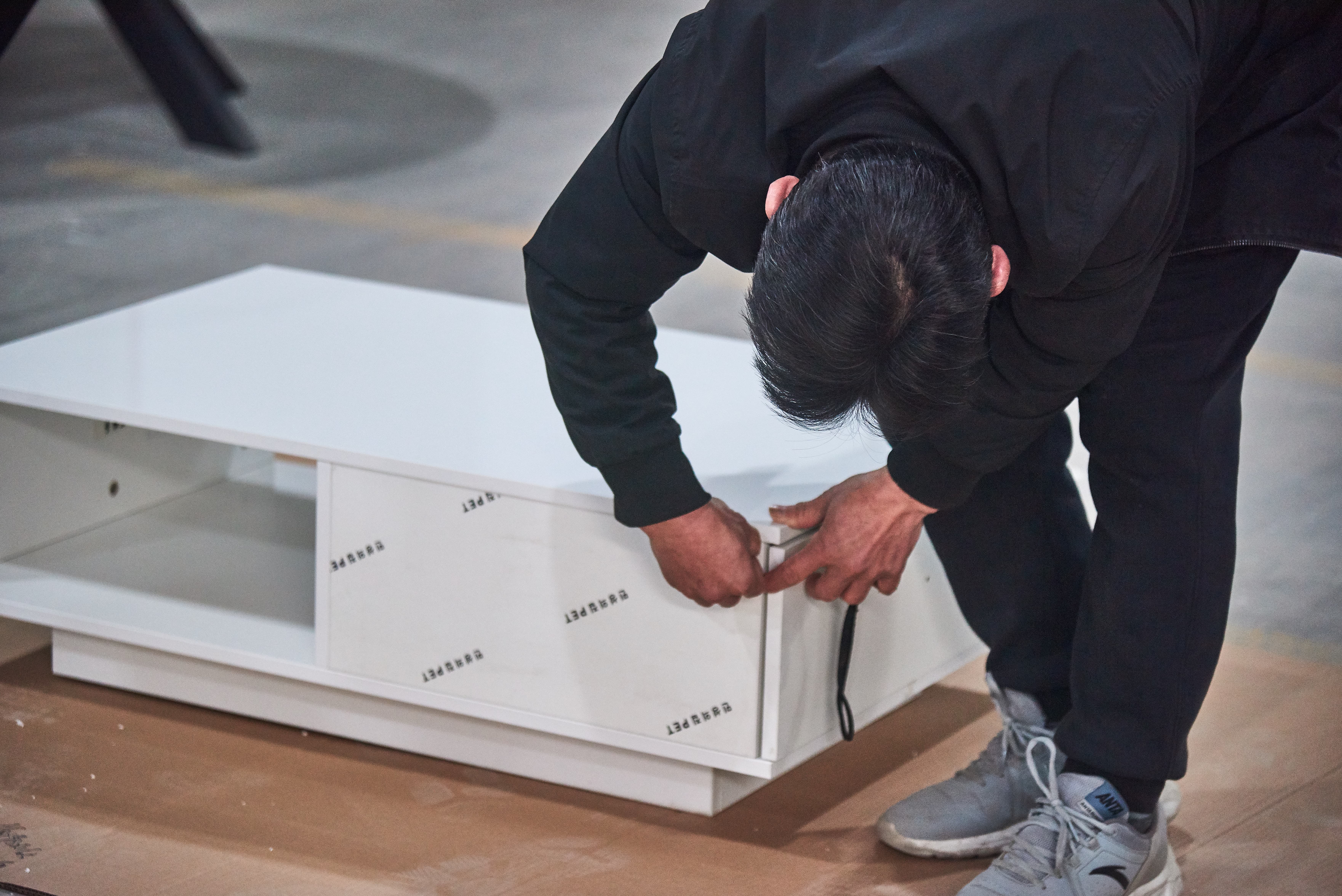 Final inspection of finished furniture before shipping