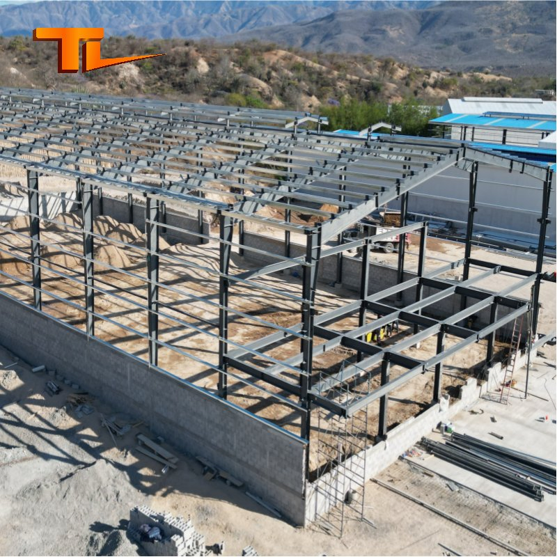 Edificios de almacenamiento de vigas H, instalaciones de almacenes prefabricados con estructura duradera para la construcción de talleres y naves industriales
