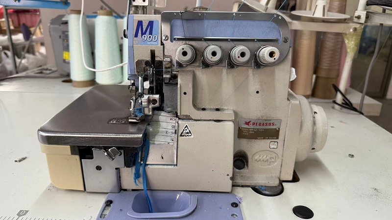 Over-lock serger machine for clean garment edges at CGE Clothing