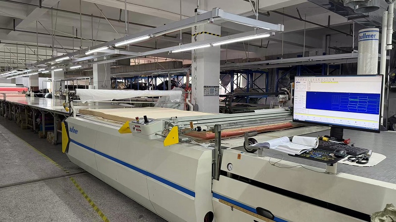 Automatic CNC cutting machine at CGE Clothing apparel factory
