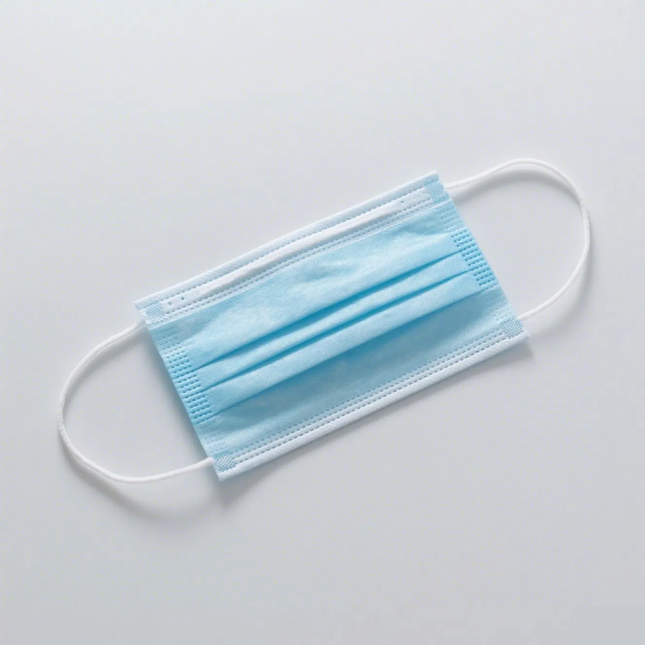 Mascarilla desechable cómoda azul con orejeras paquete a granel uso diario 3ply