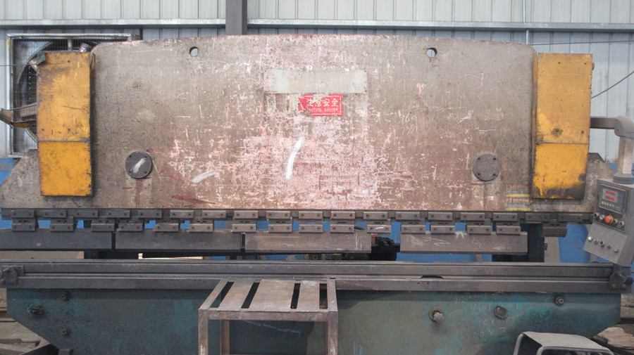 Heavy-duty bending machine at Changi Logistics production facility