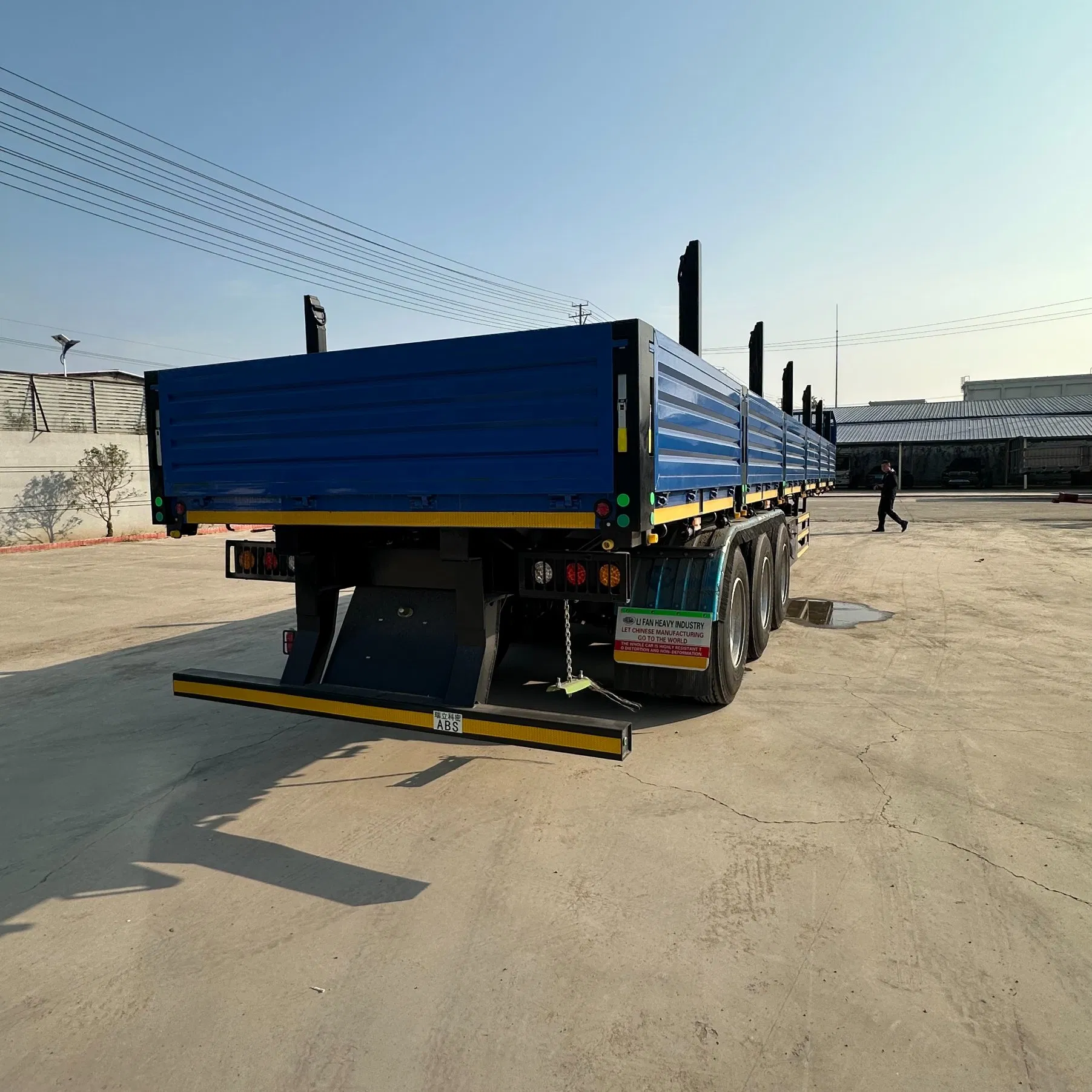Versatile Flatbed Trailer with Detachable Panels for Container and Timber Transport
